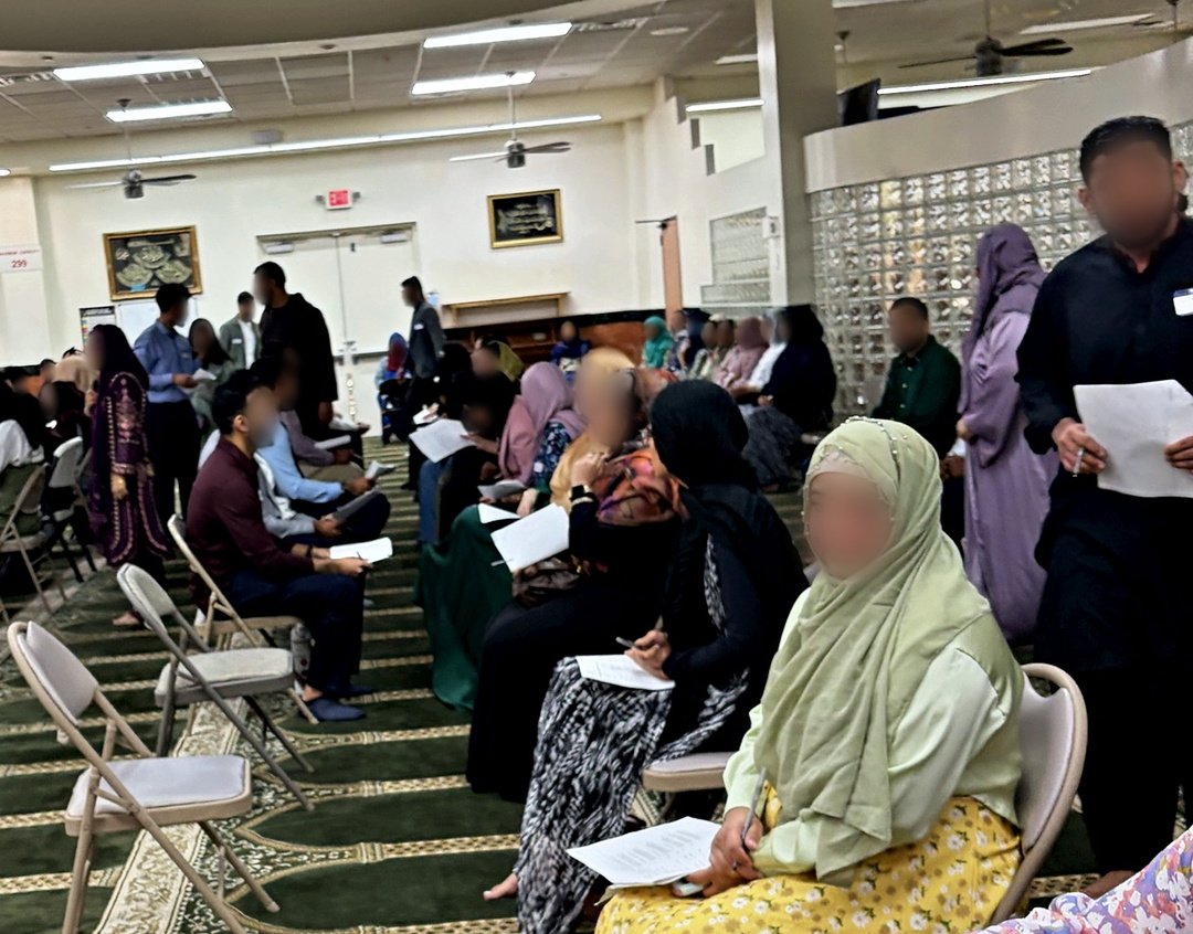 Candidates with their introduction sheets, seated in rows at Masjid At-Taqwa.