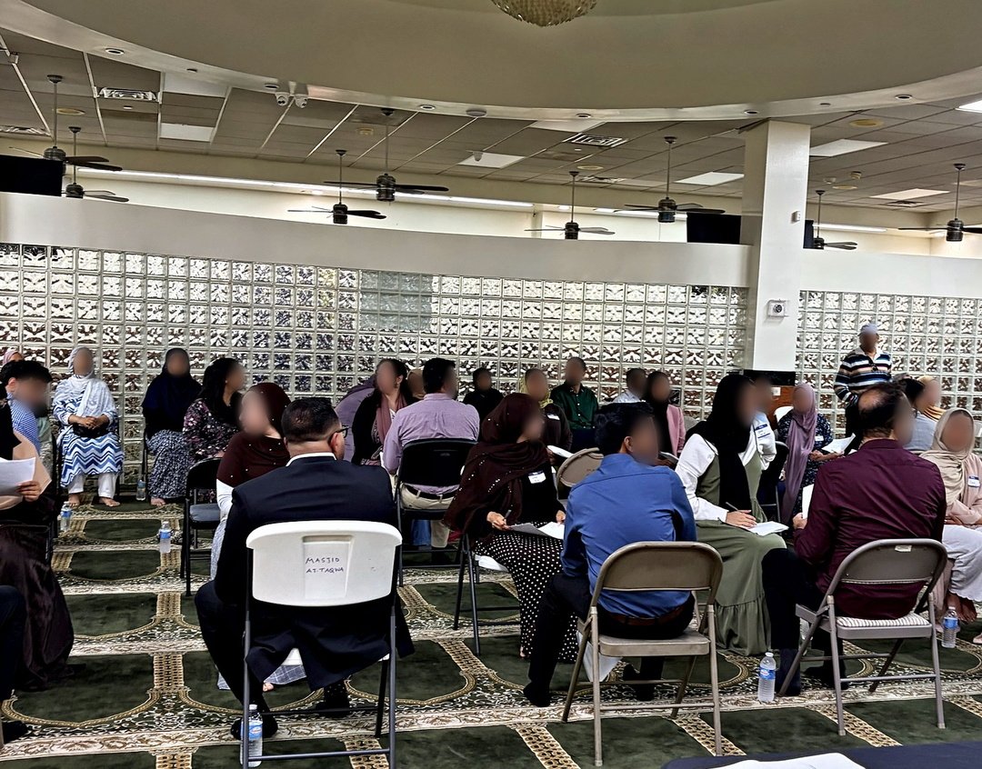 Pairs of chairs set out across the hall at Masjid At-Taqwa for the introductions.